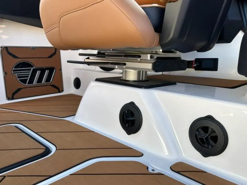 Slide: The Image of 2025 Malibu 22 LSV interior with tan seating and modern speaker system. - 18