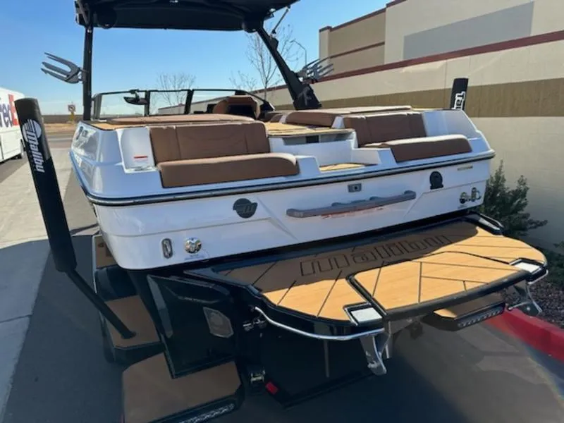 Slide: The Image of 2025 Malibu 22 LSV boat with sleek design and spacious seating. - 8