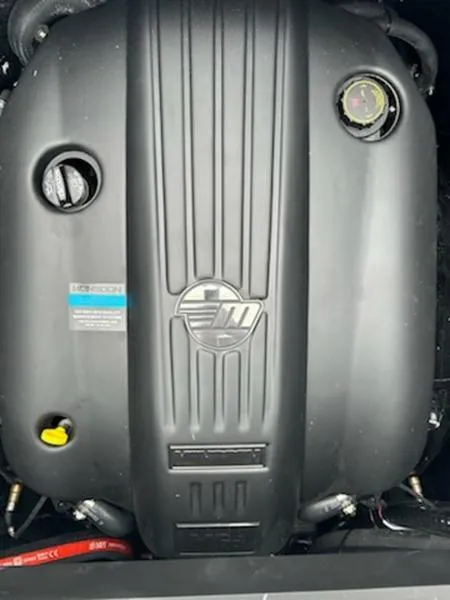 Slide: The Image of 2025 Malibu 22 MXZ engine close-up, showcasing sleek design and components. - 15