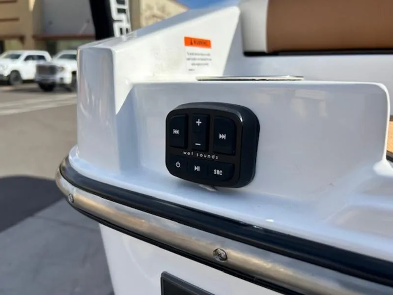 Slide: The Image of 2024 Axis T235 boat audio control panel on white exterior. - 10