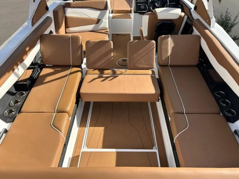 Slide: The Image of 2024 Axis T235 boat interior with tan leather seating and modern design. - 11