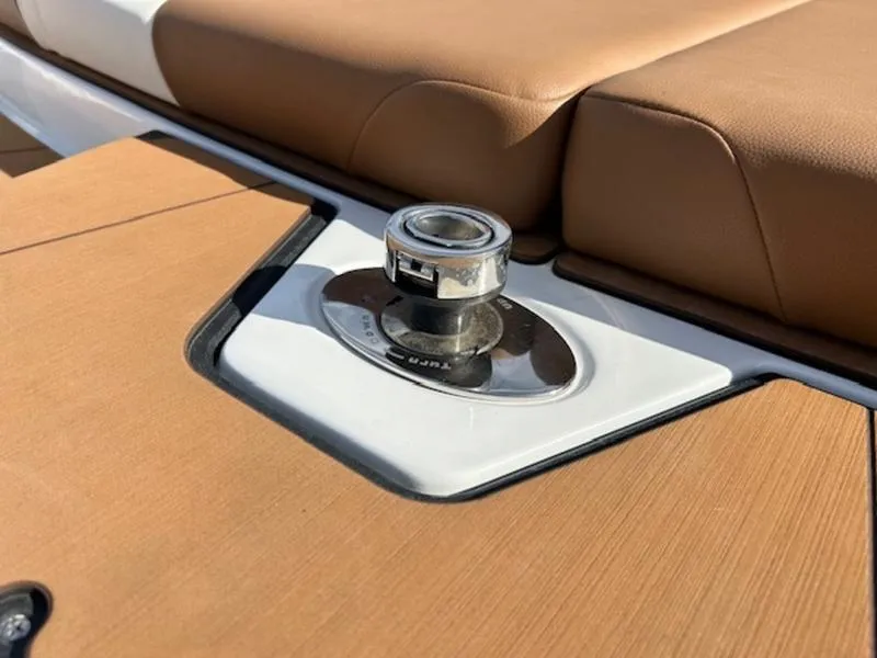 Slide: The Image of 2024 Axis T235 boat detail with tan seating and polished metal fixture. - 12