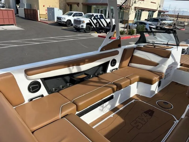 Slide: The Image of 2024 Axis T235 boat interior with tan seating and modern design. - 14