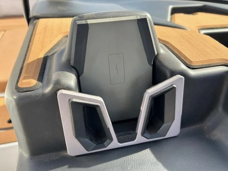 Slide: The Image of 2024 Axis T235 wireless phone charging dock with sleek design. - 17