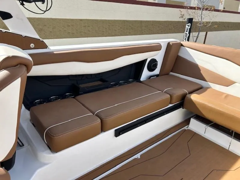 Slide: The Image of 2024 Axis T235 boat interior with brown and white seating, modern design. - 21