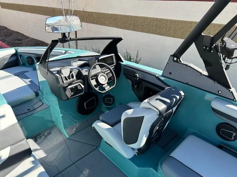 Slide: The Image of 2024 Axis T250 boat interior with modern dashboard and seating. - 12