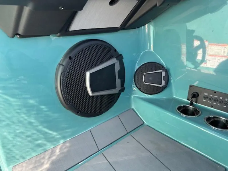 Slide: The Image of 2024 Axis T250 boat interior with speakers and control panel. - 14