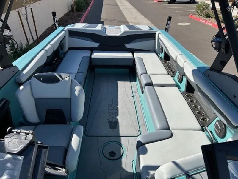 Slide: The Image of 2024 Axis T250 boat interior with spacious seating and modern design. - 18