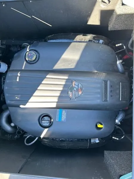 Slide: The Image of 2024 Axis T250 engine compartment with visible components and branding. - 3