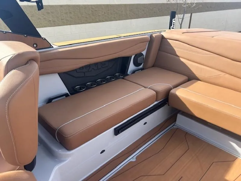 Slide: The Image of 2025 Axis A225 boat interior with tan leather seating and modern design. - 18