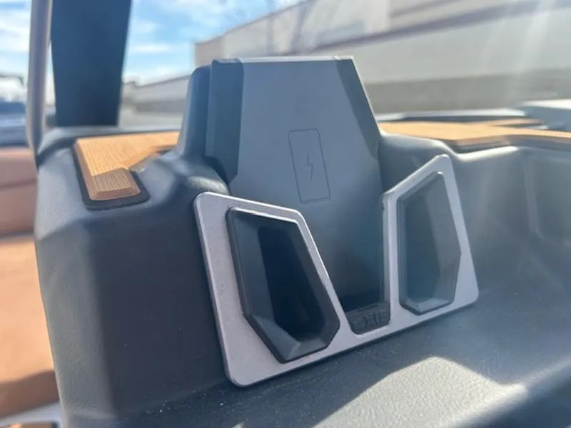 Slide: The Image of Axis A225 2025 wireless charging dock with sleek design and wood accents. - 19