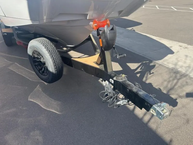 Slide: The Image of Boat trailer with Axis A225, 2025 model, parked on asphalt. - 6