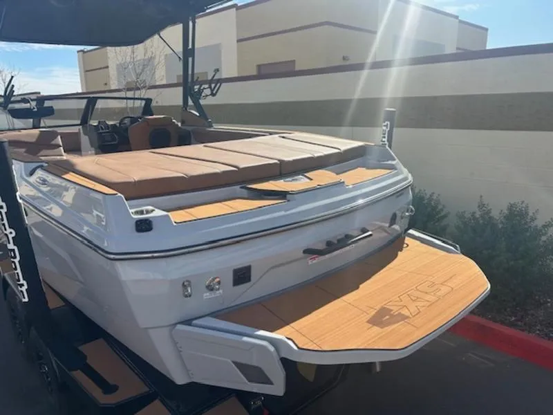 Slide: The Image of 2025 Axis A225 boat with teak deck, rear view in sunlight. - 8