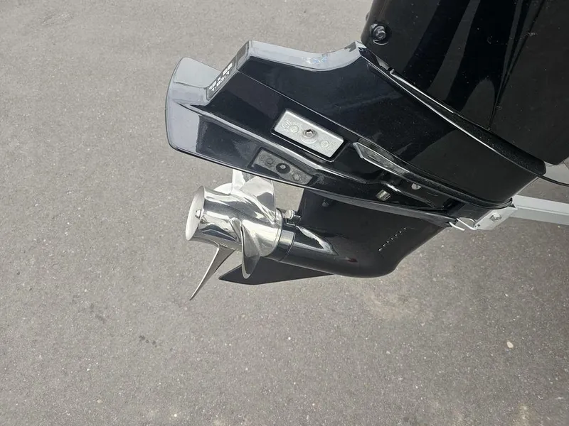 Slide: The Image of 2025 Mako Pro Skiff 15 CC outboard motor with shiny propeller. - 14