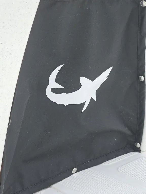 Slide: The Image of 2025 Mako Pro Skiff 15 CC with shark logo on black fabric. - 21