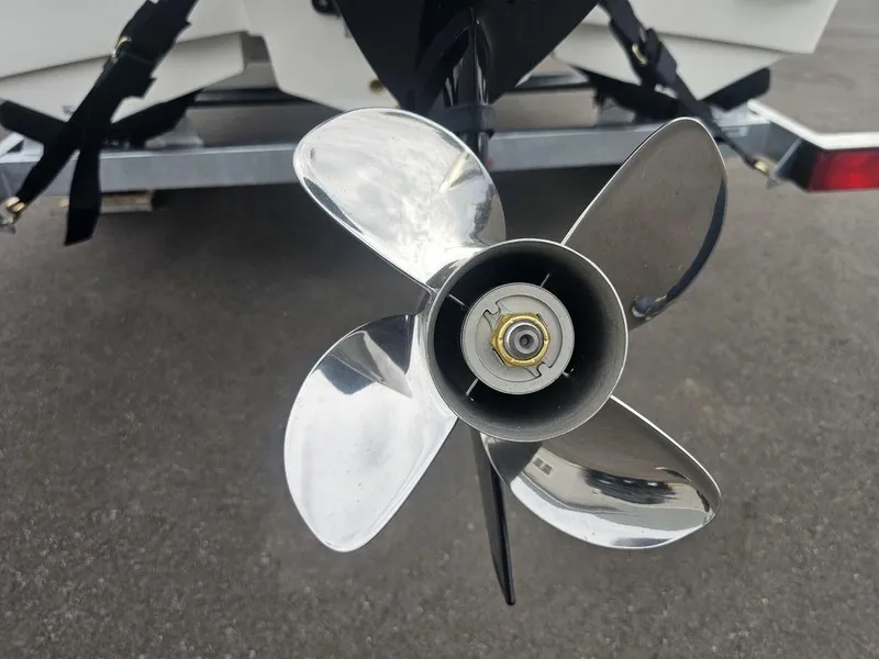 Slide: The Image of 2025 Mako Pro Skiff 15 CC boat propeller close-up on trailer. - 25