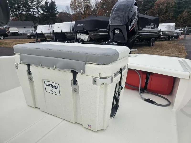 Slide: The Image of 2025 Mako Pro Skiff 15 CC with cooler seat and Mercury outboard motor. - 28