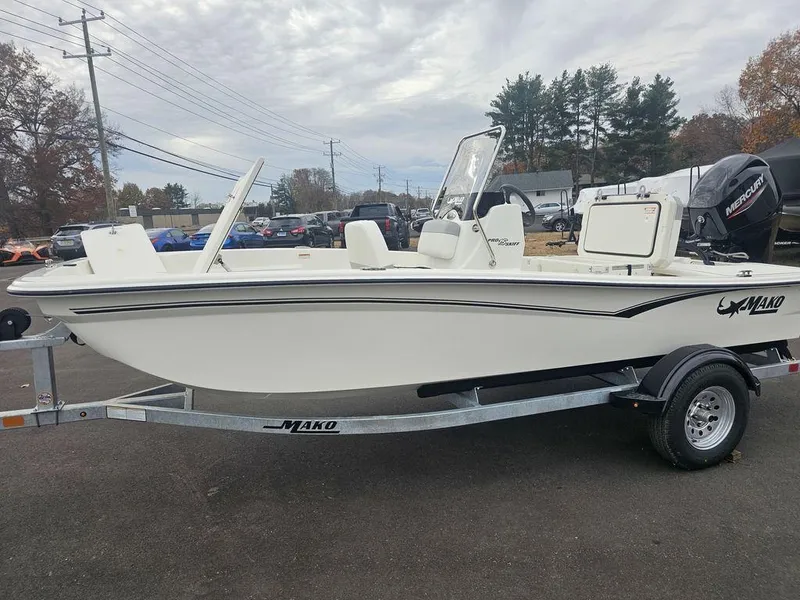 Slide: The Image of 2025 Mako Pro Skiff 15 CC boat on trailer, parked outdoors. - 3