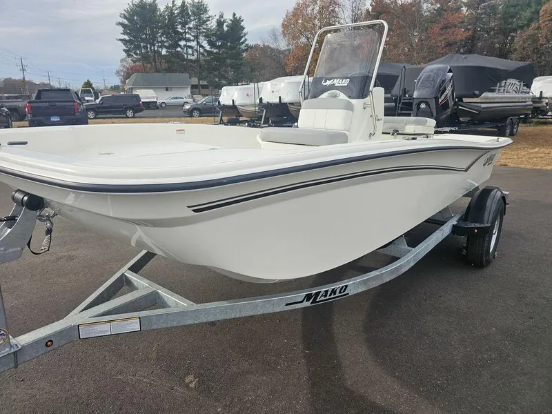 Slide: The Image of 2025 Mako Pro Skiff 15 CC boat on trailer, parked outdoors. - 7