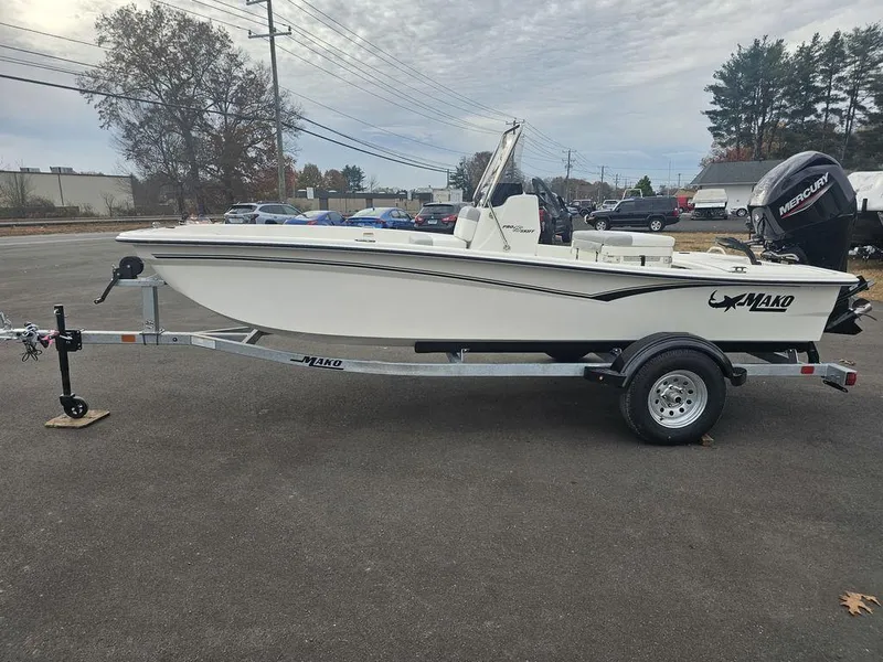 Slide: The Image of 2025 Mako Pro Skiff 15 CC boat on trailer, parked outdoors. - 8