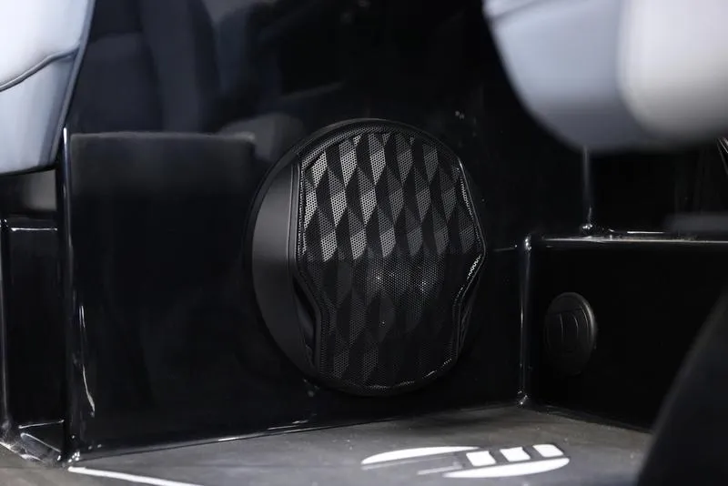 Slide: The Image of 2024 Malibu 22 LSV interior speaker detail with sleek black design. - 13