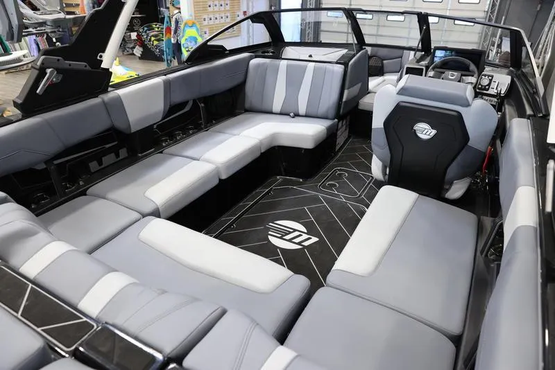 Slide: The Image of 2024 Malibu 22 LSV boat interior with spacious seating and modern design. - 16