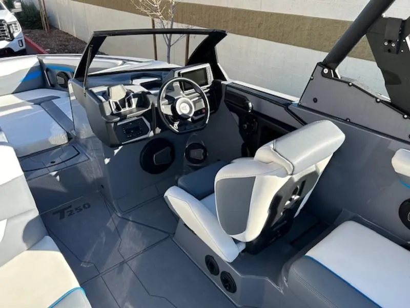 Slide: The Image of 2024 Axis T250 boat interior with modern dashboard and seating. - 10