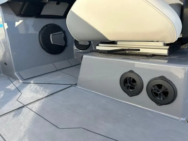 Slide: The Image of 2024 Axis T250 boat interior with speakers and seating. - 14