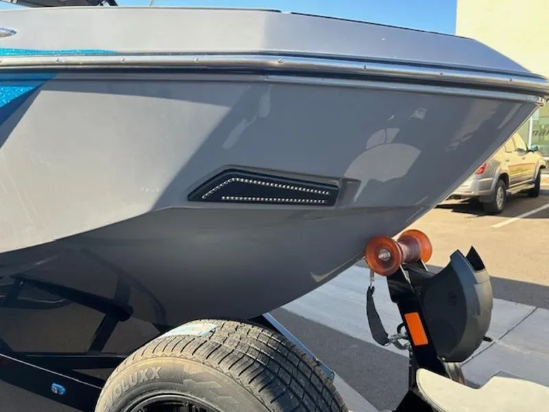 Slide: The Image of 2024 Axis T250 boat on trailer, close-up of hull and wheel. - 17