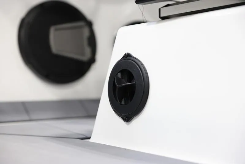 Slide: The Image of 2024 Axis A225 boat interior with black speaker detail. - 12