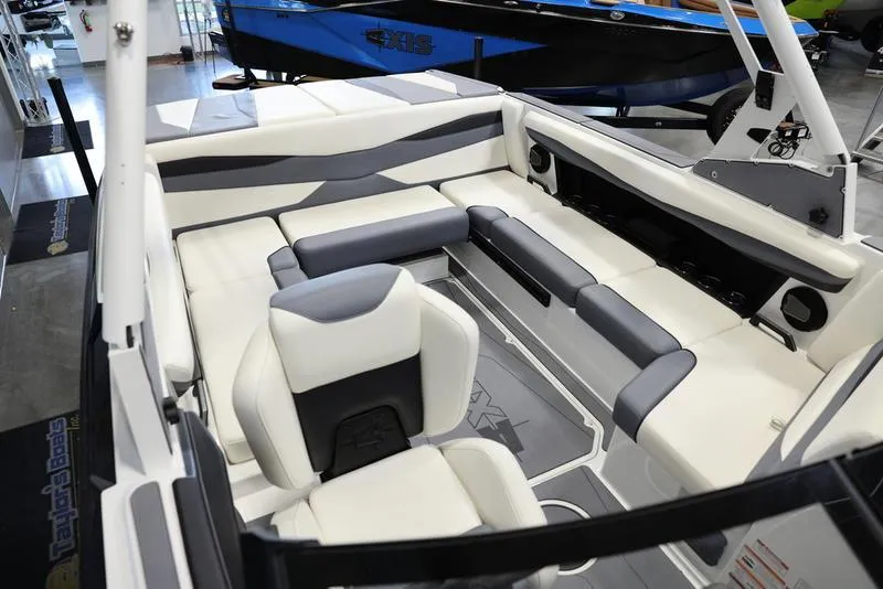 Slide: The Image of 2024 Axis A225 boat interior with white and gray seating, modern design. - 17