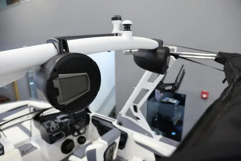 Slide: The Image of 2024 Axis A225 boat interior with mounted speaker and control panel. - 5