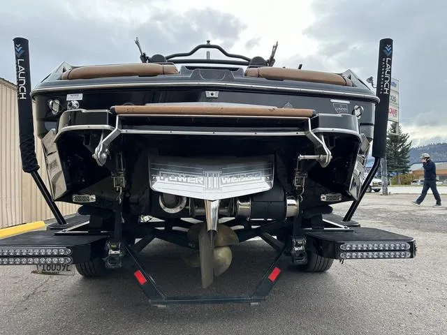 Slide: The Image of 2023 Malibu 23 LSV boat rear view with advanced wakeboard features. - 6