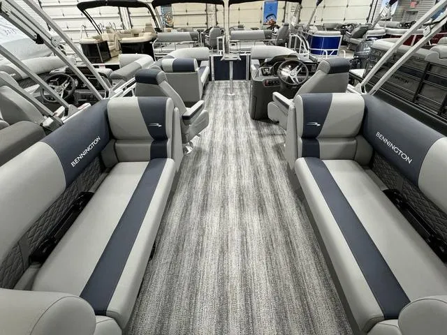 Slide: The Image of 2025 Bennington 23 SSR pontoon boat interior with gray and blue seating. - 10