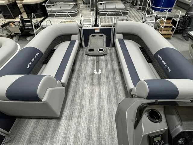 Slide: The Image of 2025 Bennington 23 SSR pontoon boat interior with gray seating and central table. - 12