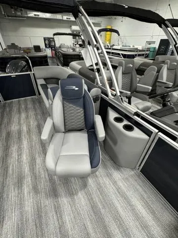 Slide: The Image of 2025 Bennington 23 SSR boat interior with gray seating and modern design. - 16