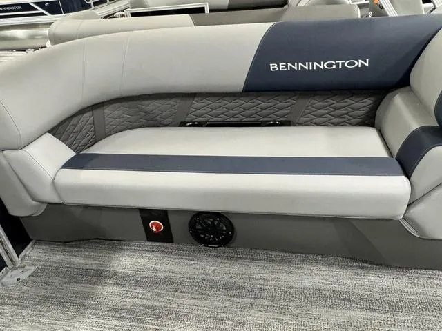 Slide: The Image of 2025 Bennington 23 SSR boat interior with gray and blue cushioned seating. - 19