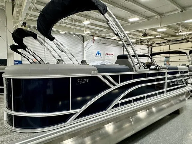 Slide: The Image of 2025 Bennington 23 SSR pontoon boat in showroom, featuring sleek design and modern amenities. - 20