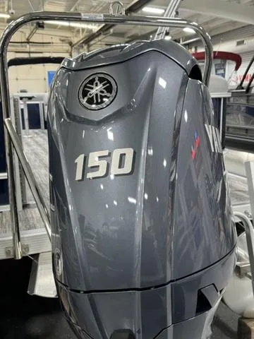 Slide: The Image of 2025 Bennington 23 SSR with Yamaha 150 outboard motor in showroom. - 24