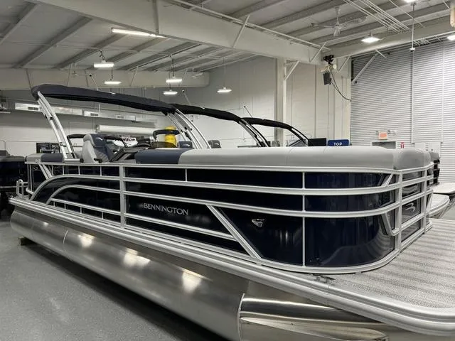 Slide: The Image of 2025 Bennington 23 SSR pontoon boat in showroom, sleek design, modern features. - 4