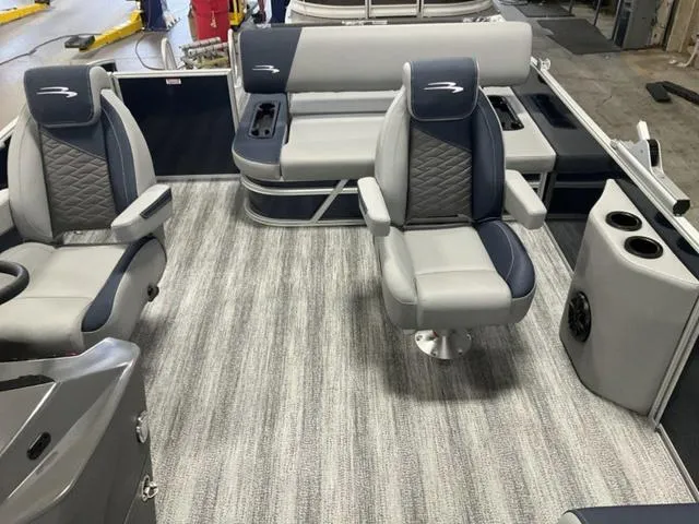 Slide: The Image of 2025 Bennington 23 SSB boat interior with gray seating and striped flooring. - 5