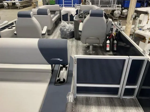 Slide: The Image of Interior of 2025 Bennington 23 SSB pontoon boat with seating and helm. - 9