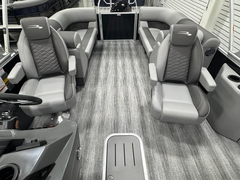 Slide: The Image of 2025 Bennington 22 SSR boat interior with gray seating and modern design. - 11