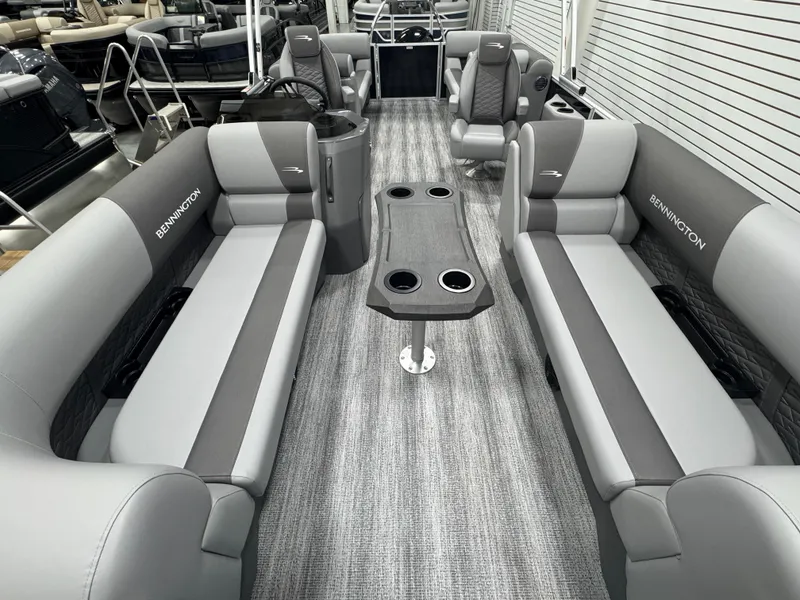 Slide: The Image of 2025 Bennington 22 SSR pontoon boat interior with gray seating and central table. - 14