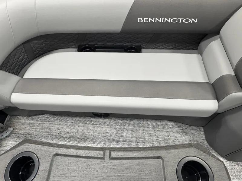 Slide: The Image of 2025 Bennington 22 SSR boat interior with cushioned seating and cup holders. - 15