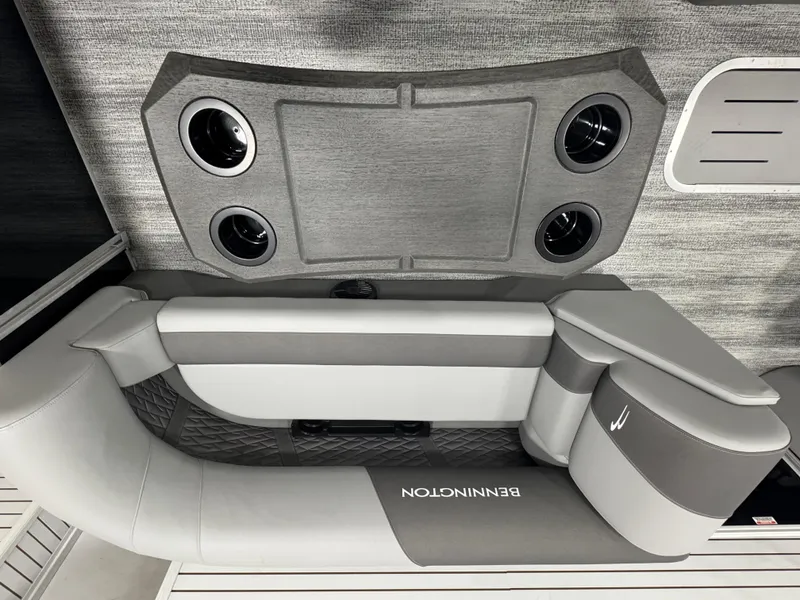 Slide: The Image of 2025 Bennington 22 SSR boat interior with gray seating and cup holders. - 18
