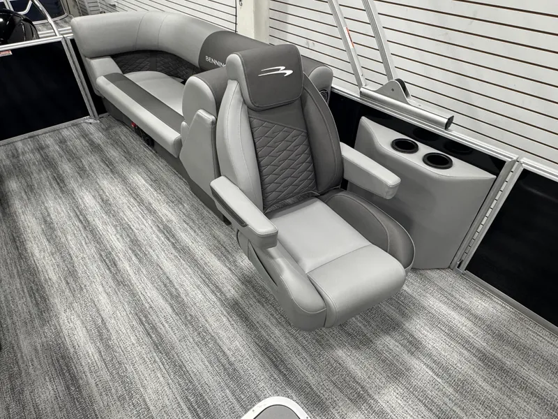 Slide: The Image of Luxurious seating on 2025 Bennington 22 SSR pontoon boat with modern design and cup holders. - 19
