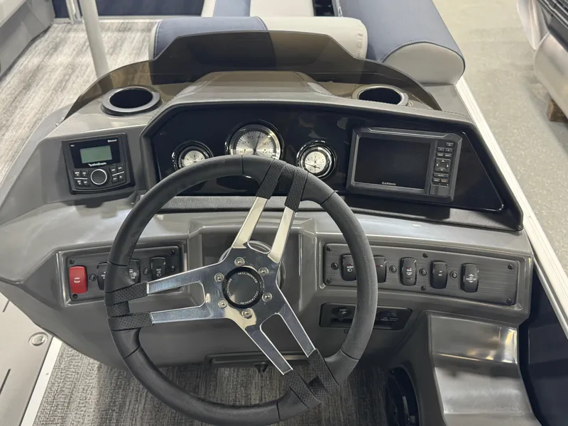 Slide: The Image of Dashboard of 2025 Bennington 22 SSB boat with steering wheel and control panel. - 10