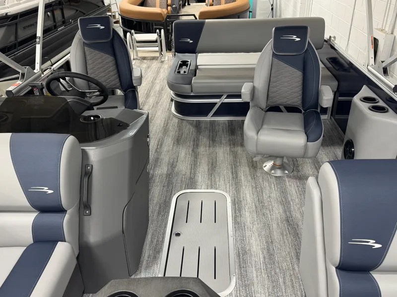 Slide: The Image of Interior of 2025 Bennington 22 SSB pontoon boat with modern seating and steering console. - 12