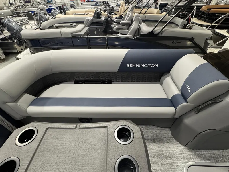 Slide: The Image of 2025 Bennington 22 SSB pontoon boat interior with sleek seating and cup holders. - 15